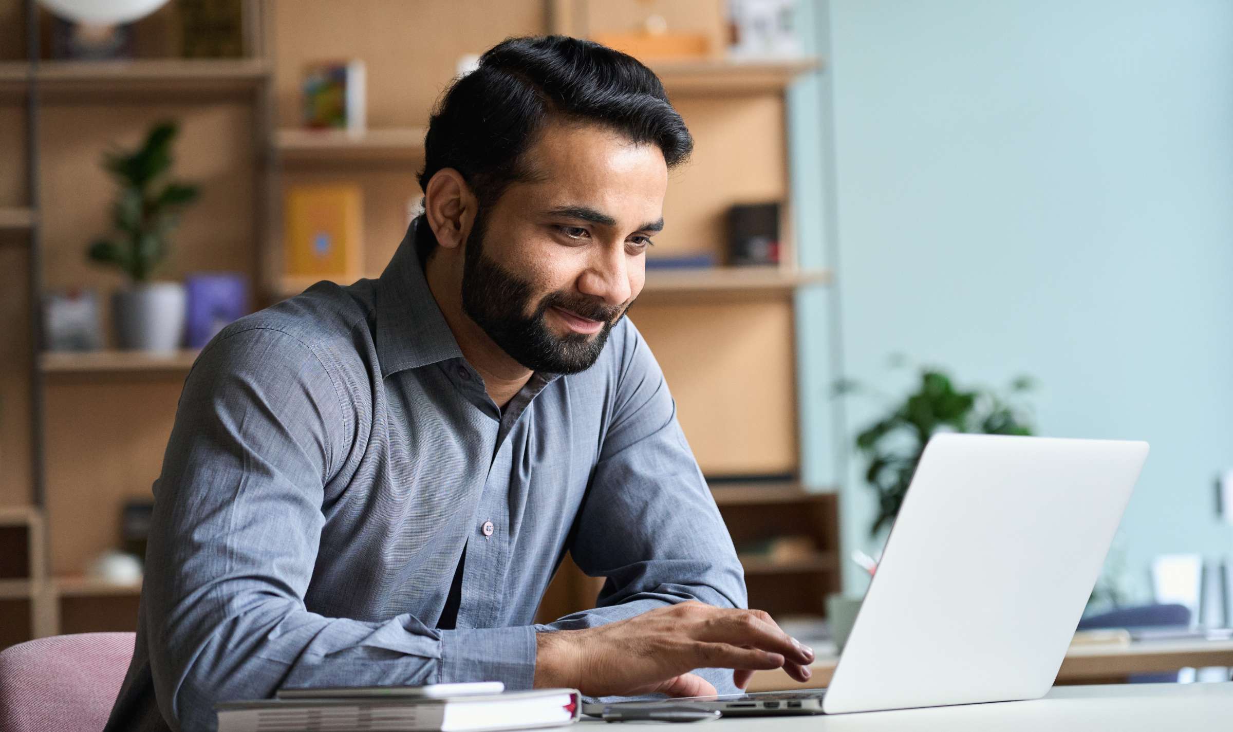 A man uses a laptop