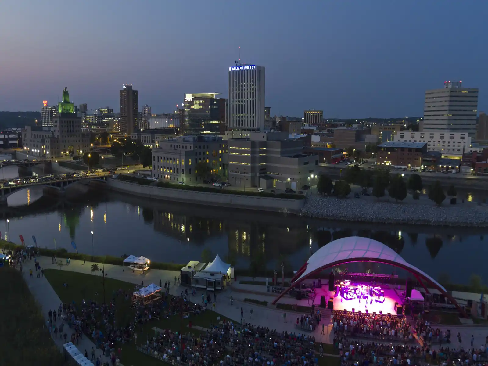 Aerial view of Cedar Rapids with buildings and a concert being performed