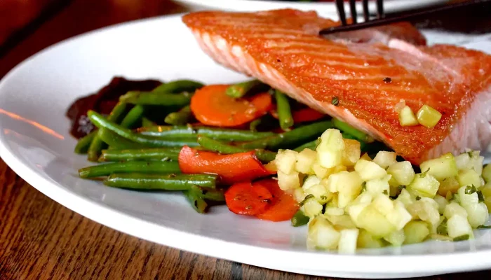 A close up of salmon and asparagus