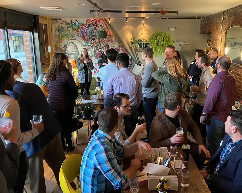 A group of people enjoy music in a small bar and wine venue