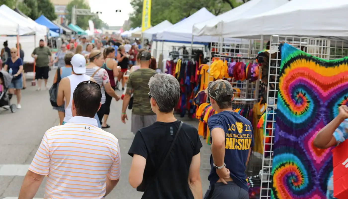 Patrons walk the streets of the Cedar Rapids Downtown Farmers' Market