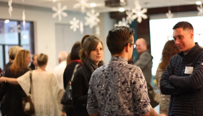 Young people discuss business in a room