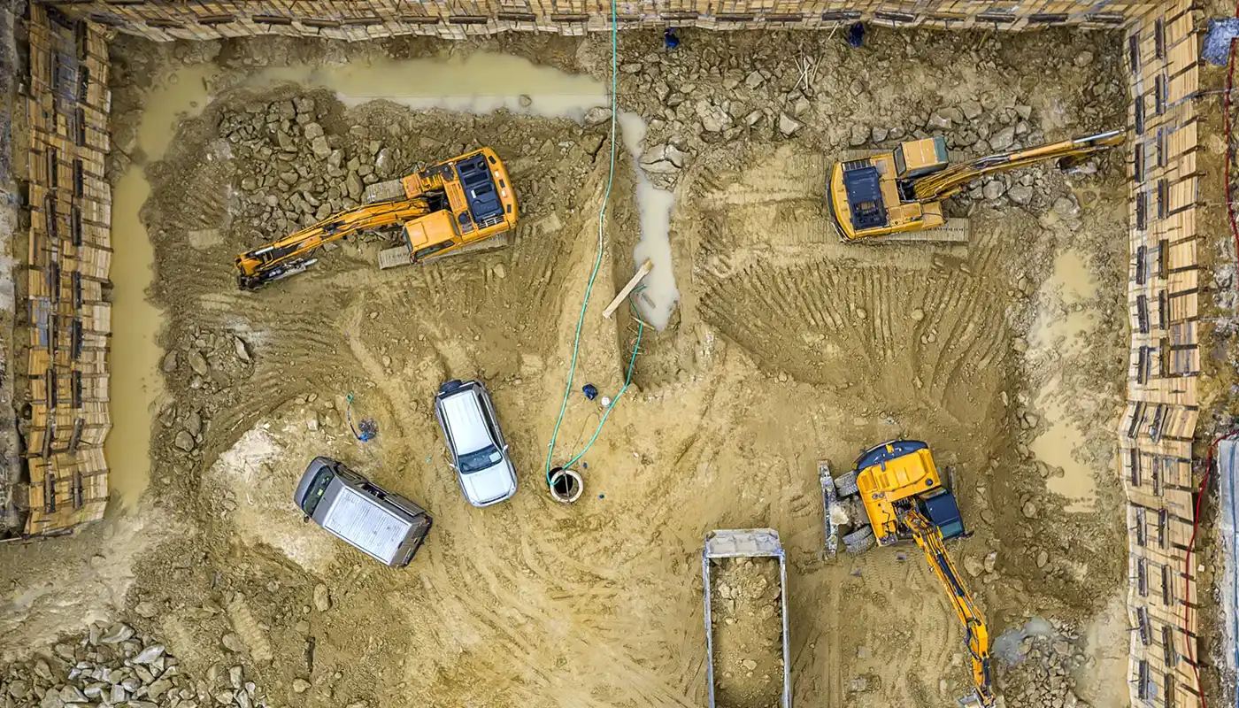 Overhead view of a construction site with large scale equipment