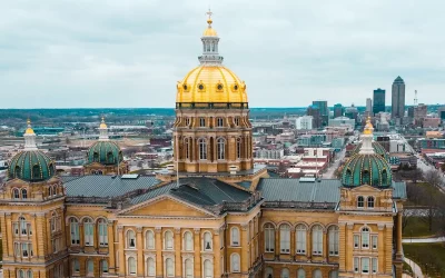 The Iowa state capitol with dome from an aerial shot with Des Moines skyline in the distance