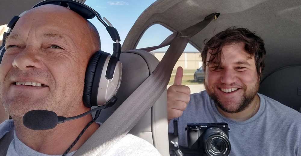 Two men in a small airplane