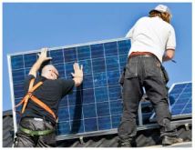 Two people setting solar panel