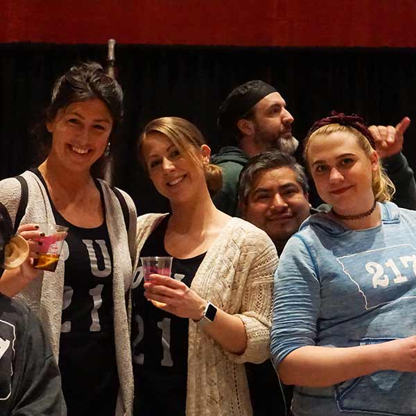 Three People posing for a picture in corporate event