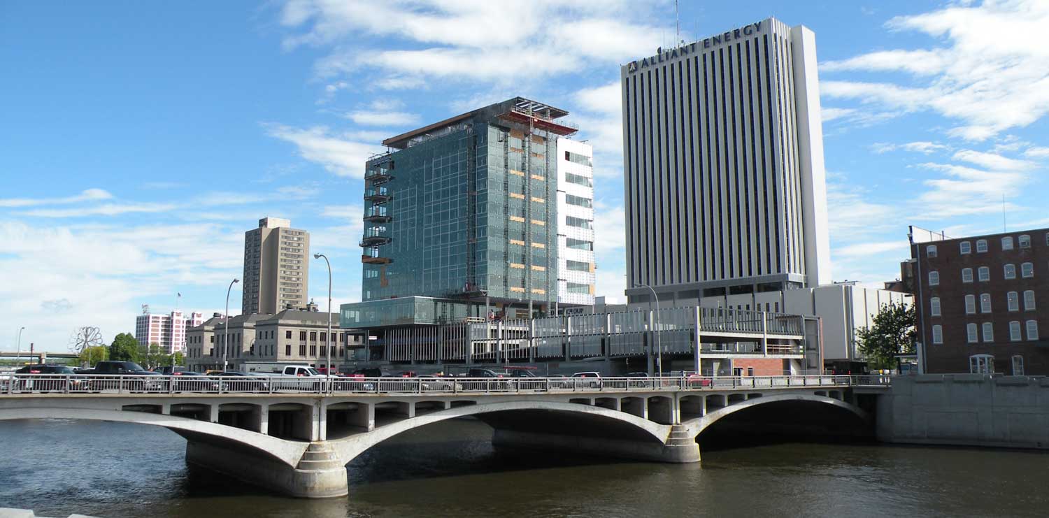 high rise building with river bridge