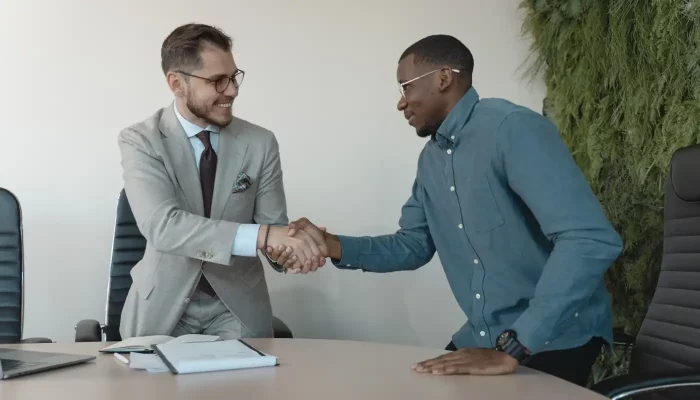 Two business people shake hands