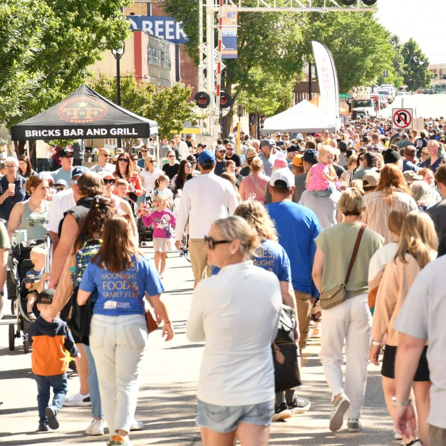 People attending the Cedar Rapids Downtown Farmers Market in Cedar Rapids, Iowa
