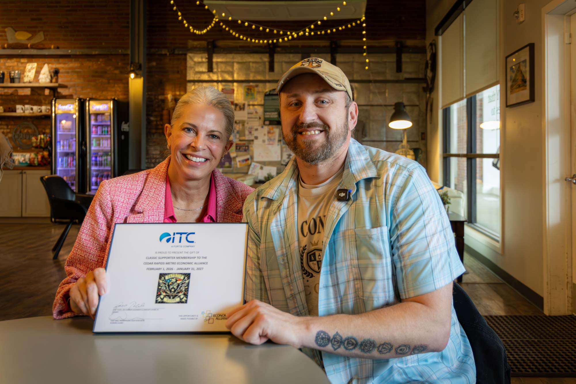 ITC and Patriot Recover Residences hold donated 1-year membership to the Economic Alliance